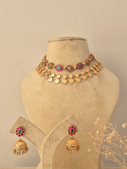 Close-up of a traditional Indian two-layer temple design necklace set featuring colorful stones by Naitri.in