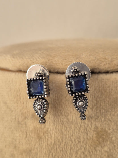 Handcrafted oxidized silver earrings with blue stone by naitri.in