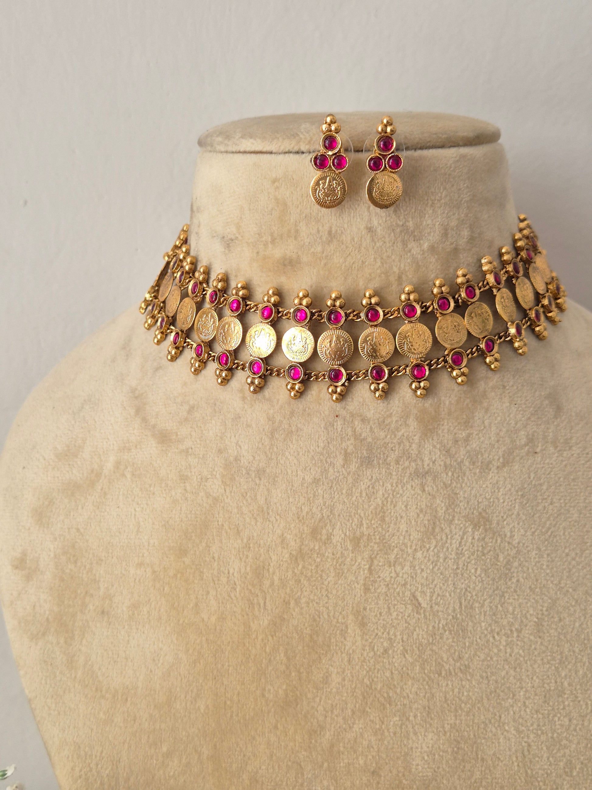 Elegant green gemstone and gold-toned ethnic coin jewelry set, gold-plated choker and earring set with green beads by naitri.in