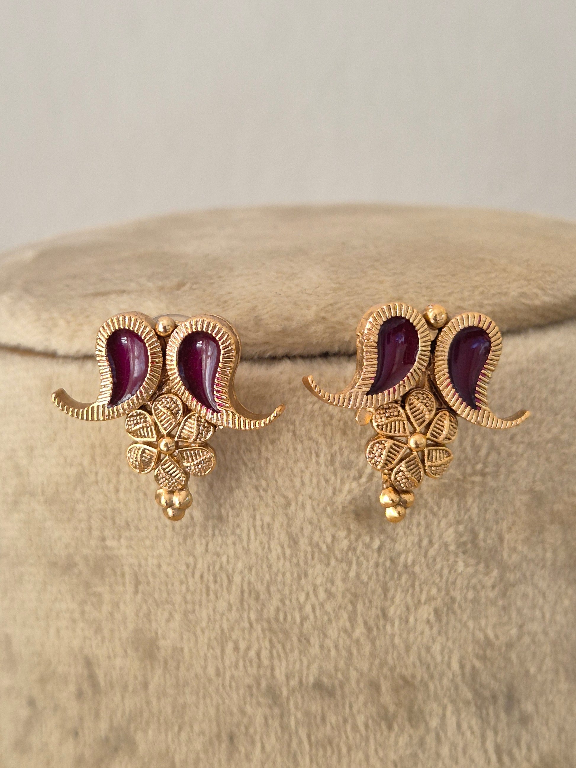A pair of gold-toned traditional Indian jhumka earrings with deep wine enamel, by naitri.in