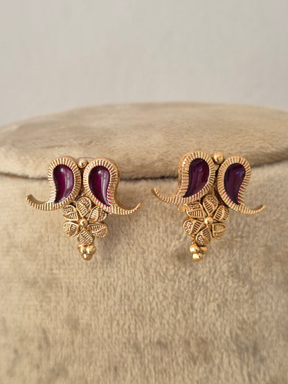 A pair of gold-toned traditional Indian jhumka earrings with deep wine enamel, by naitri.in