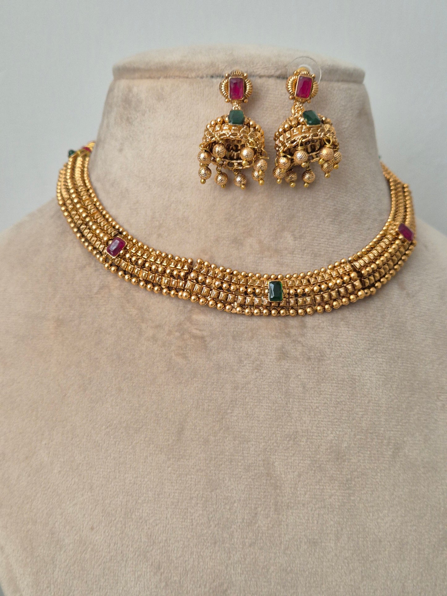 Traditional elegant necklace set with green and red stones with Jhumki available at naitri.in