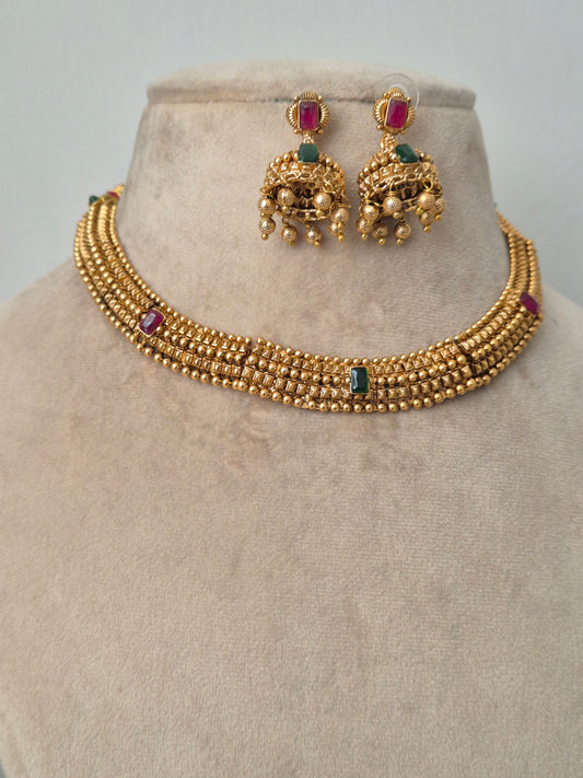 Traditional elegant necklace set with green and red stones with Jhumki available at naitri.in