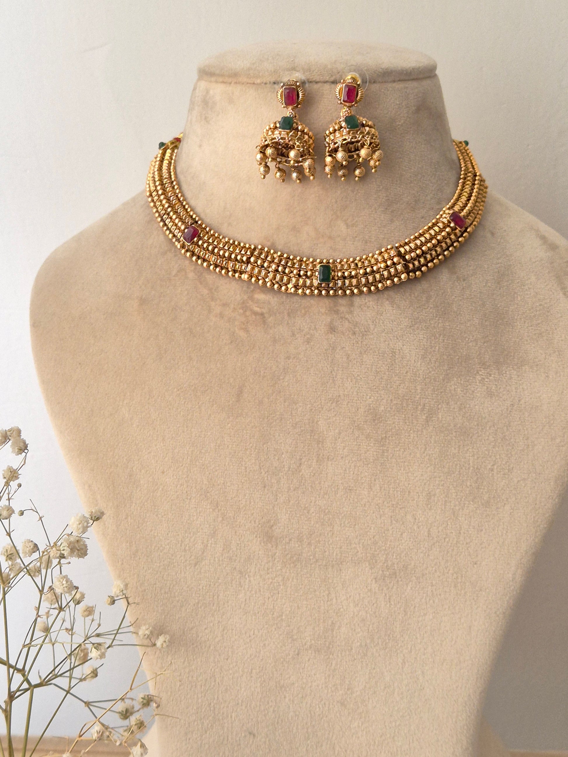 Traditional elegant necklace set with green and red stones with Jhumki available at naitri.in