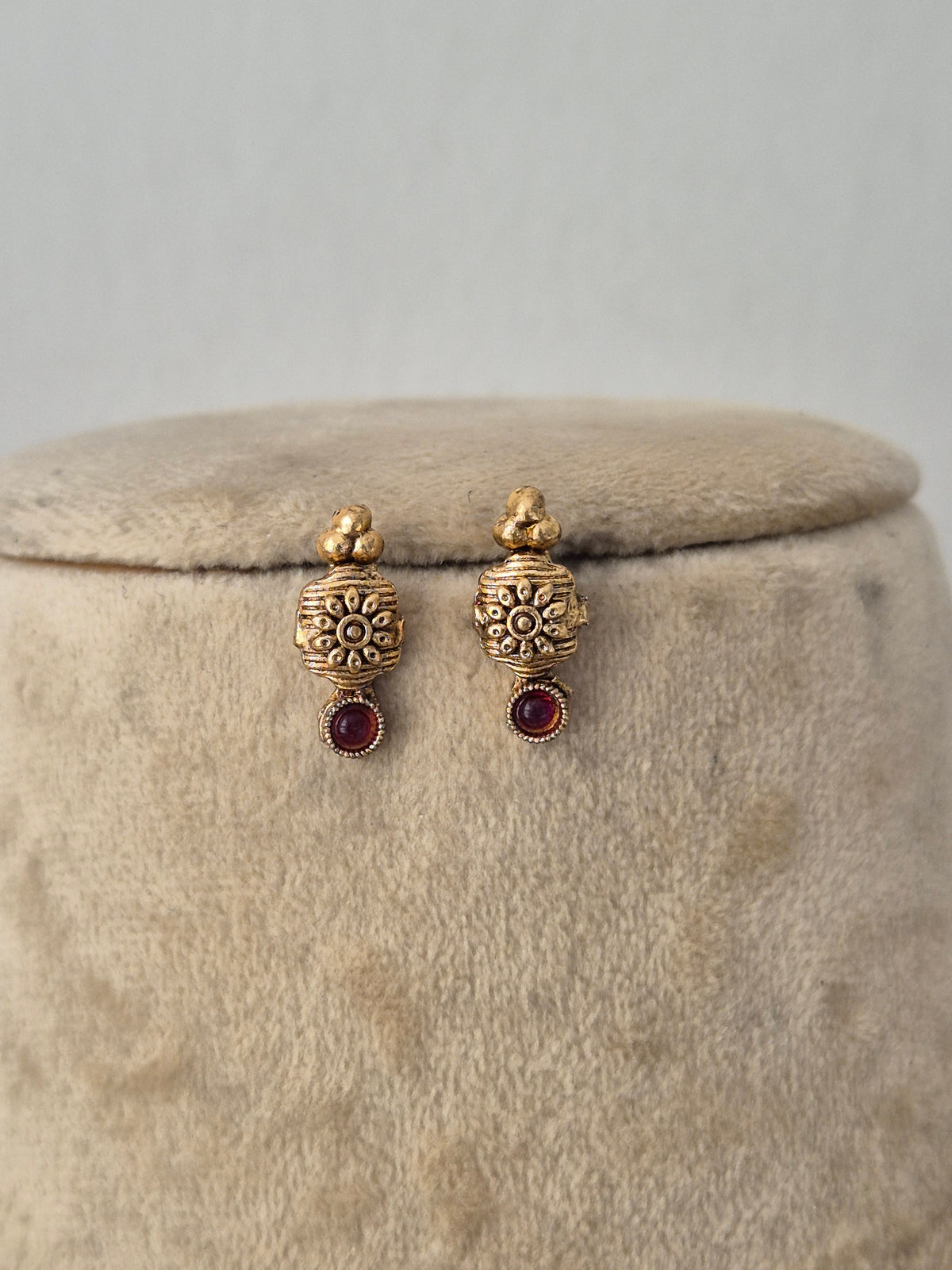 Traditional Indian ethnic gold earring set with gemstone details by Naitri.in