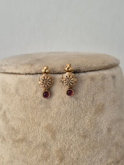 Traditional Indian ethnic gold earring set with gemstone details by Naitri.in