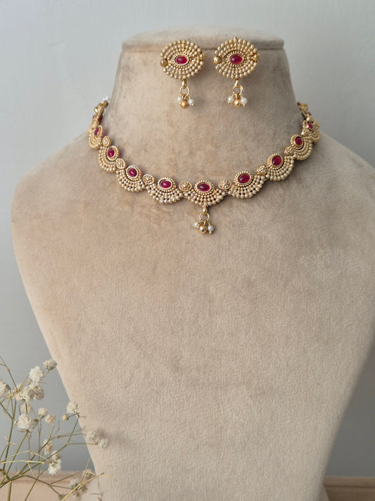 Gold necklace with red stones necklace traditional design by naitri.in