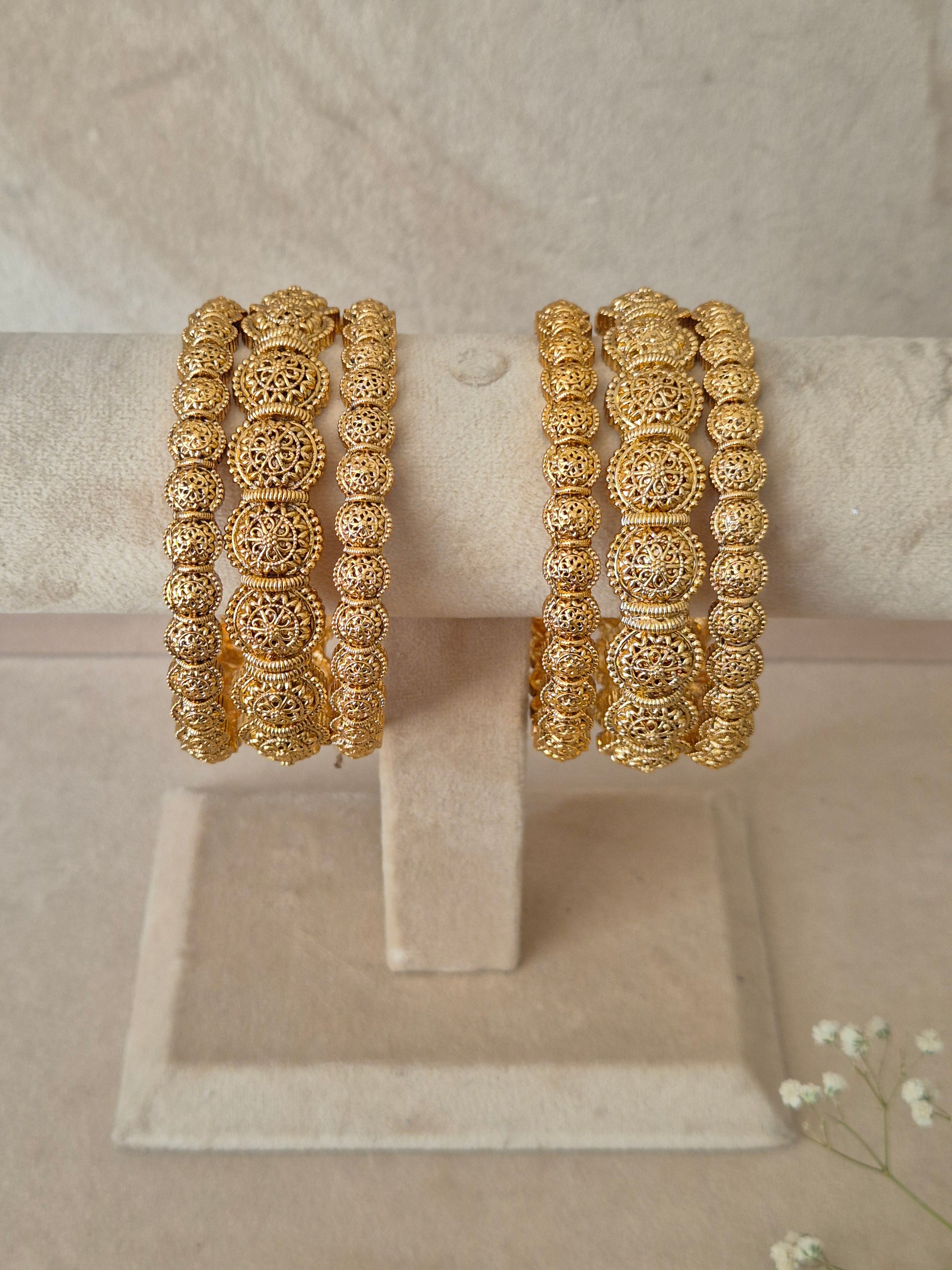 Festive style golden statement bangles by naitri.in