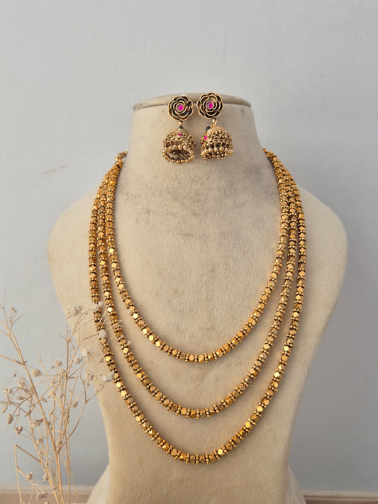 Handcrafted brass alloy ethnic layered necklace and traditional earrings by Naitri