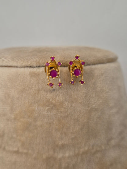 Modern Indian aesthetic earring with a dainty stone-studded ruby-red stones highlights, perfect for elegant ethnic or festive wear by naitri.in