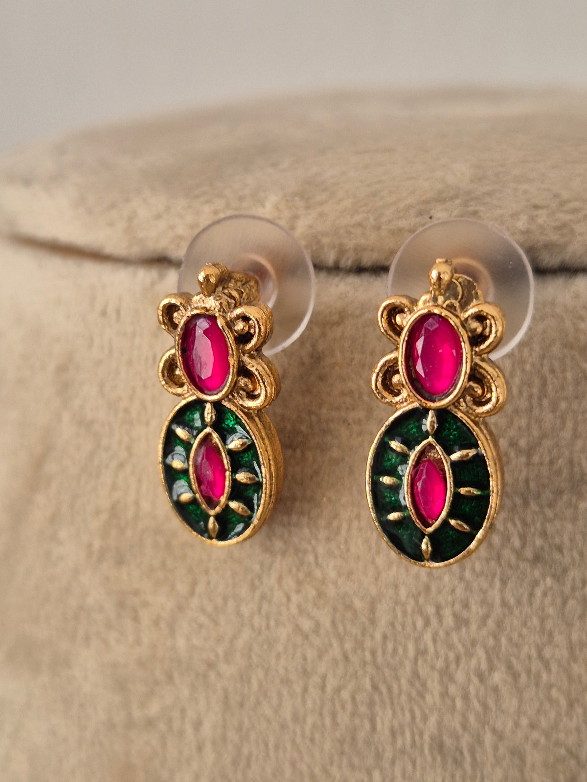 Suman matching drop earrings in antique gold finish featuring ruby and emerald stones by Naitri.in