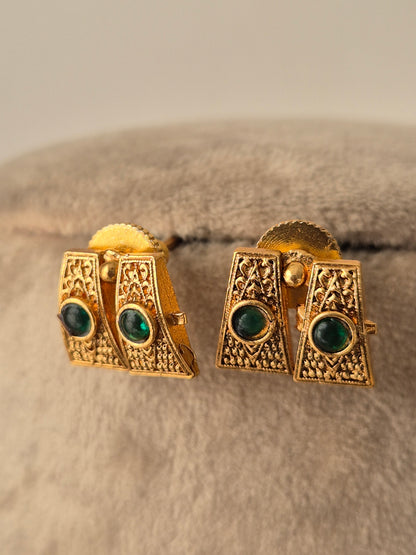 Gold earrings with green gemstones Handcrafted gold-plated brass Antique gold with Green-colored stone accents by naitri.in