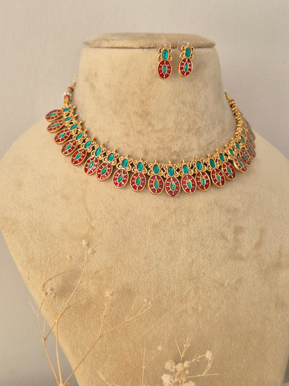 Handcrafted brass alloy traditional Indian necklace set with intricate deity carvings and stone embellishments by Naitri.in