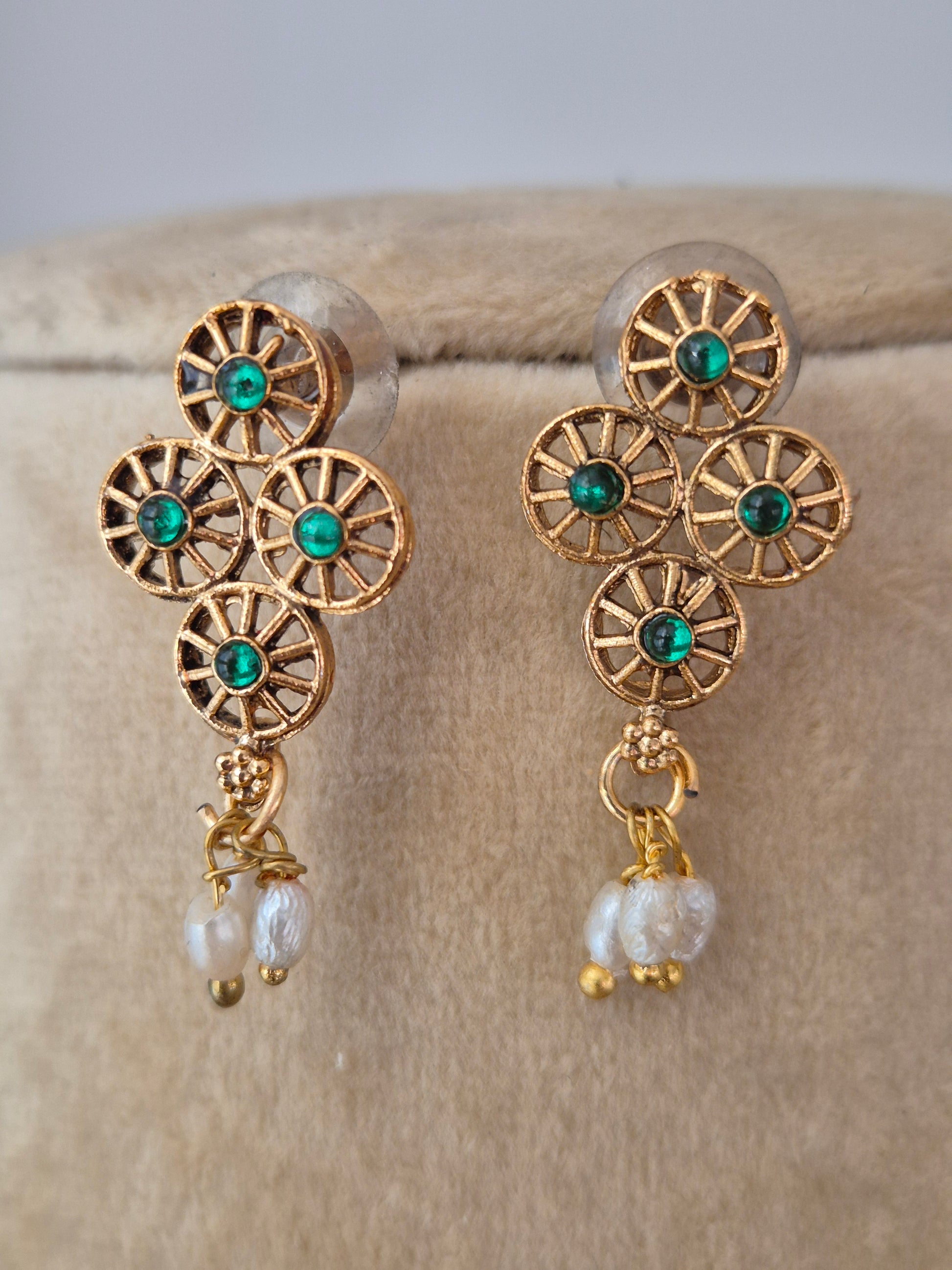 Tashvi gold-plated strand green stones embellishments and matching gold beadwork handcrafted from brass alloy by naitri.in