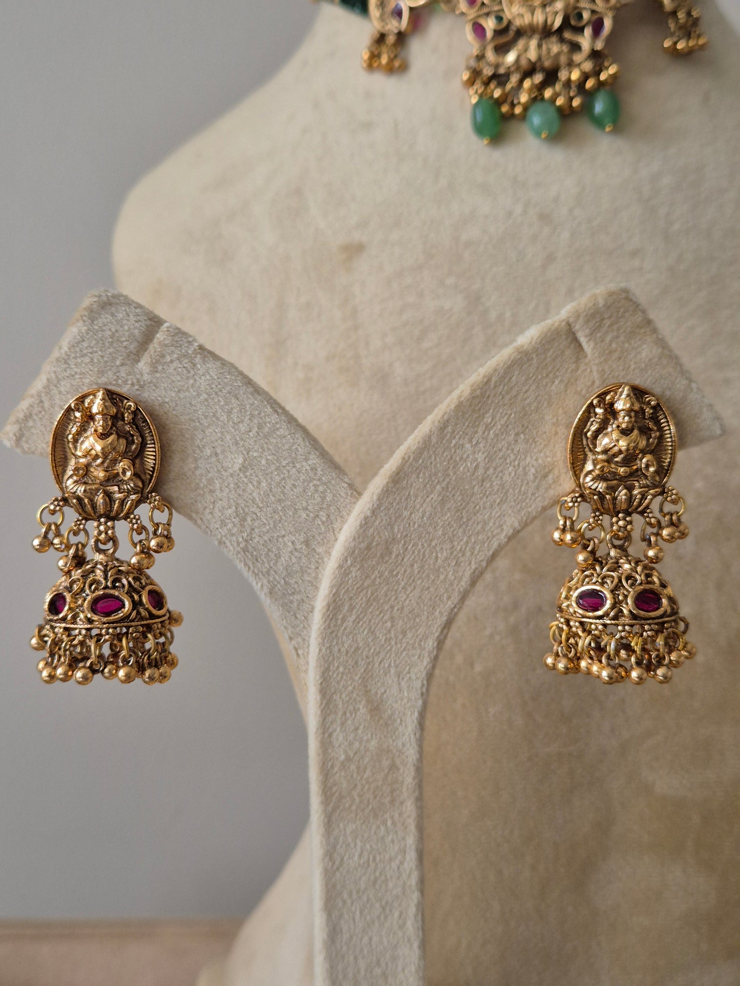 Antique gold earrings goddess Lakshmi motif , gold drops, ruby pink stones by naitri.in