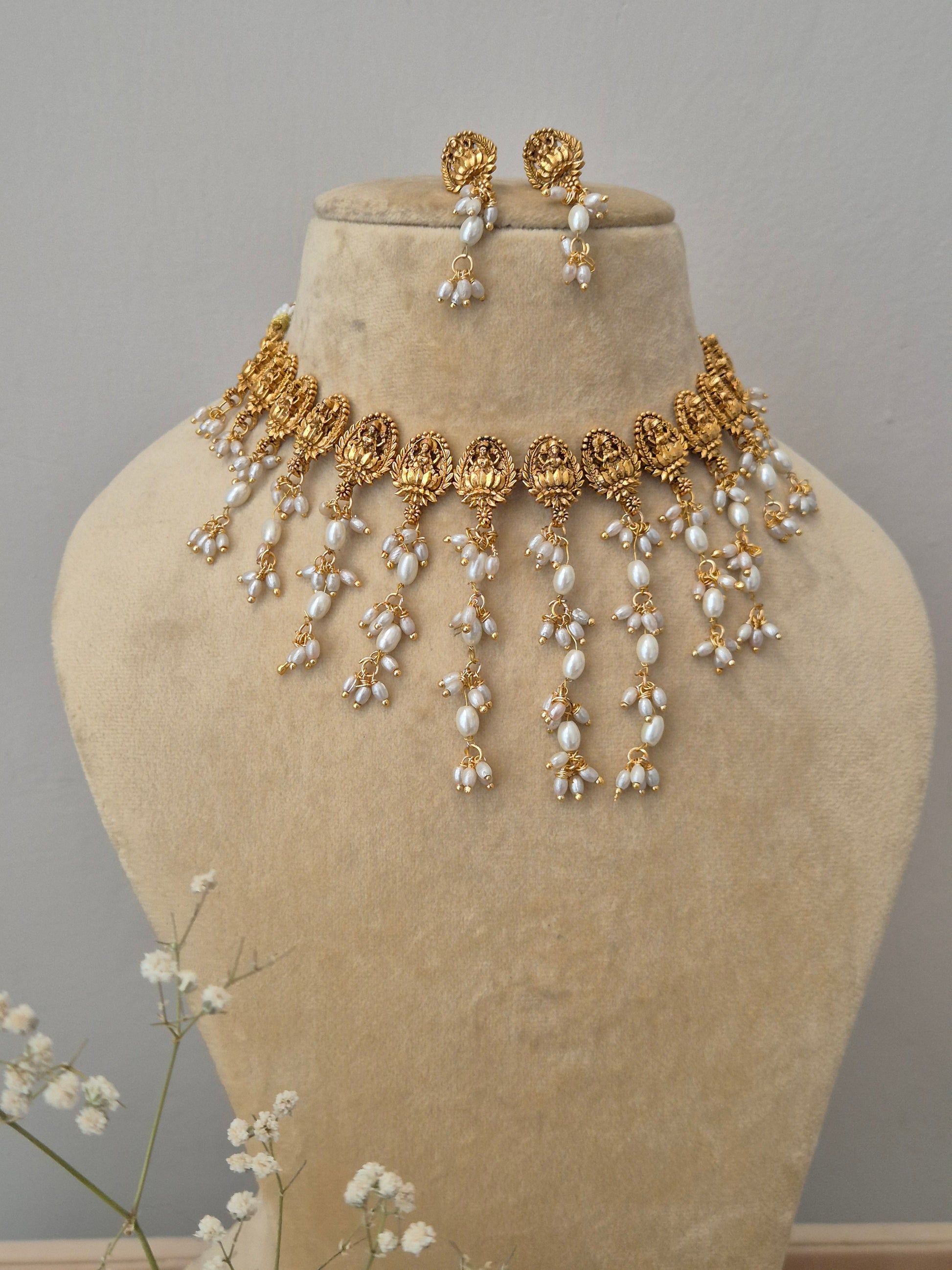 Traditional Indian style gold-finished choker necklace set with white pearls for women - imitation jewelry by NAITRI.in