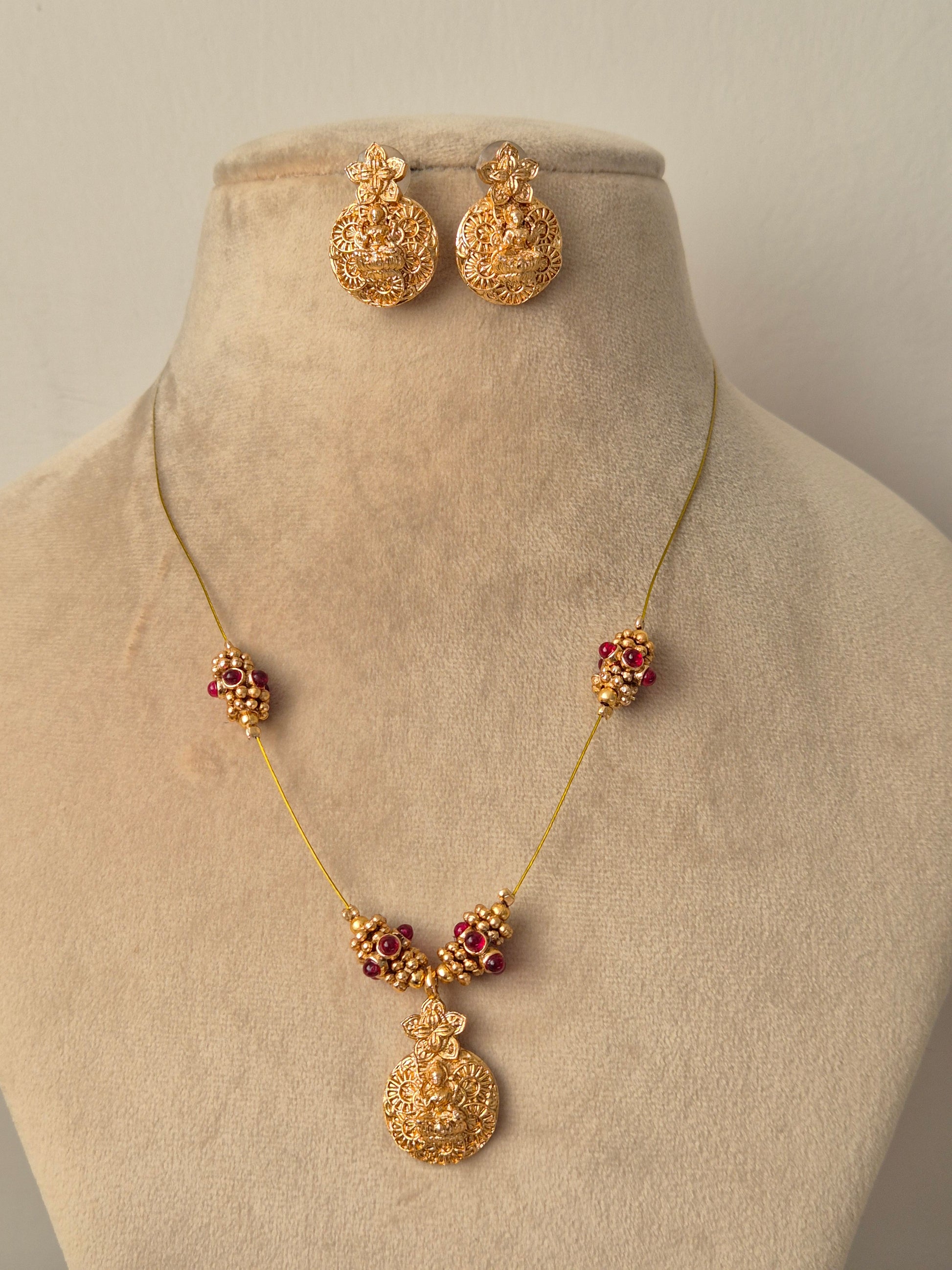 Antique gold-plated temple jewelry, red kemp stones, matching jhumka earrings by naitri.in