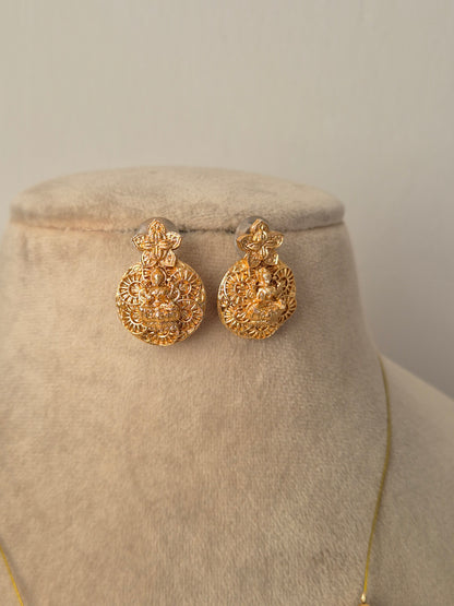 Gold earrings Antique gold-plated, featuring a central Goddess Lakshmi motif by naitri.in