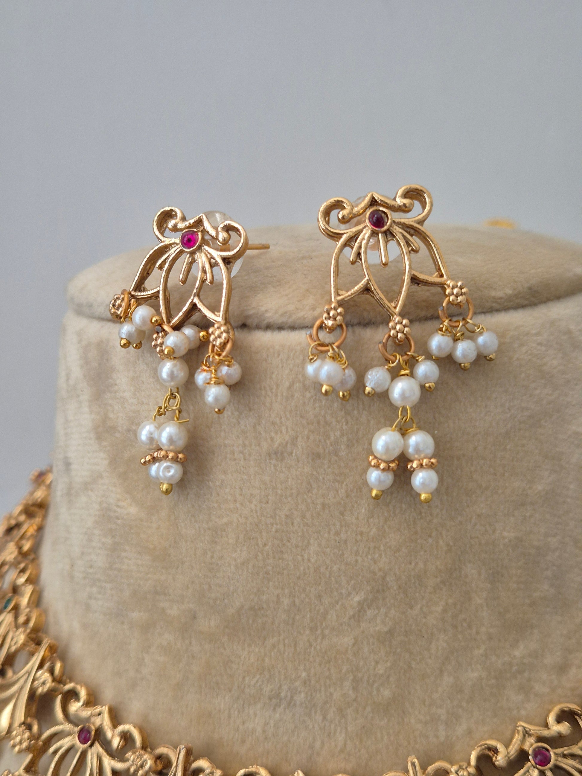 Indian traditional gold necklace set with pearls and matching earrings for women - Naitri Golden Jewellery collection by naitri.in