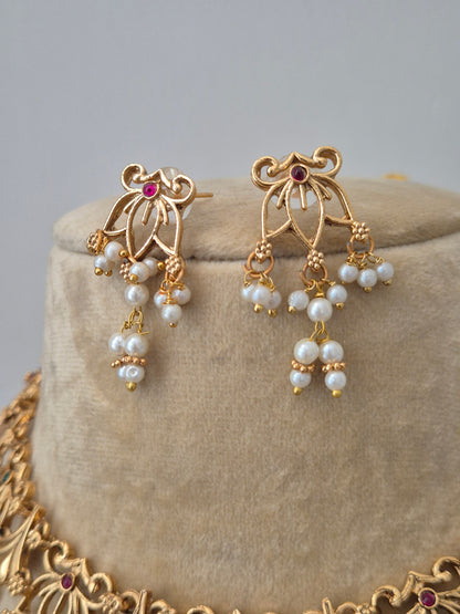 Indian traditional gold necklace set with pearls and matching earrings for women - Naitri Golden Jewellery collection by naitri.in
