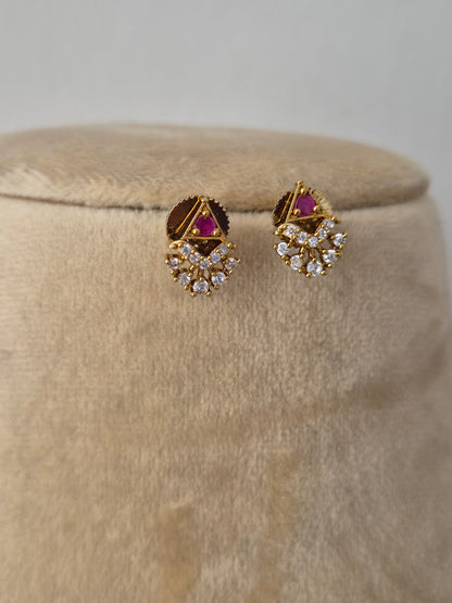 Delicate gold-toned earring dangling ethnic charms accented with small pink and clear gemstones, by naitri.in