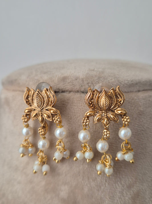 Gold and pearl earrings lotus designed earring looks heavy but light weight easy to carry by naitri.in