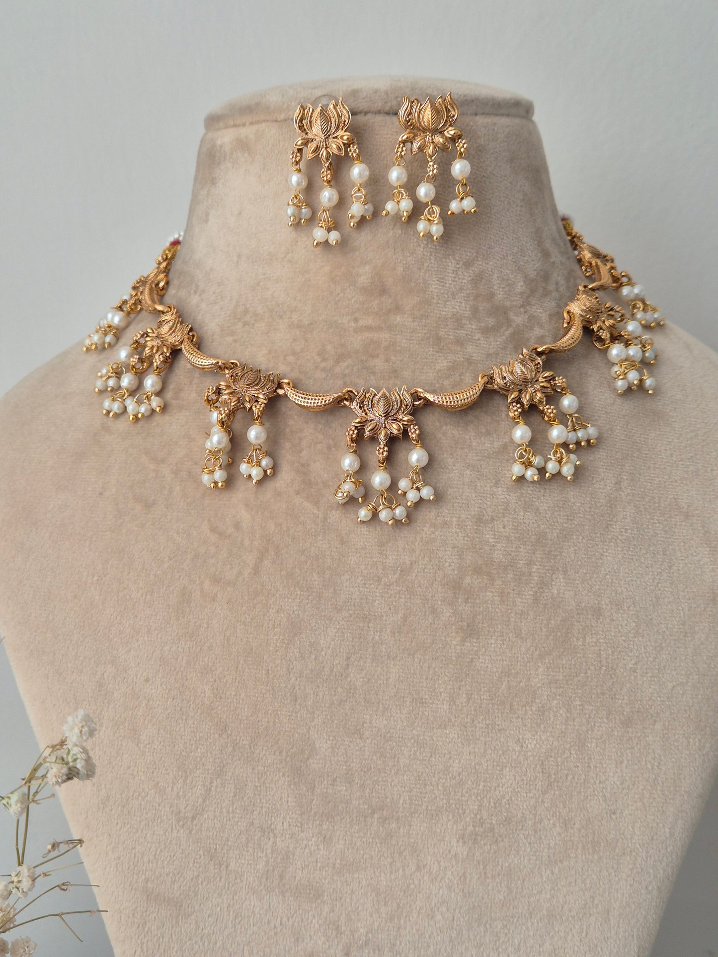  lotus designed necklace and earring looks heavy but light weight easy to carry looks perfect for festive looks  by naitri.in