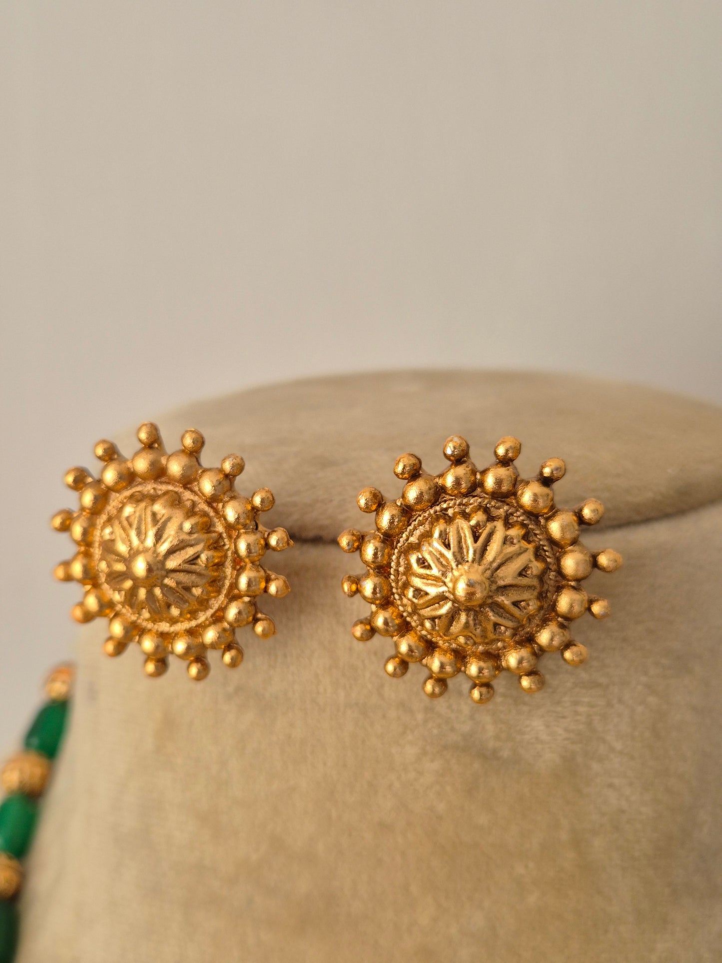 gold-toned and circular stud earrings by naitri.in