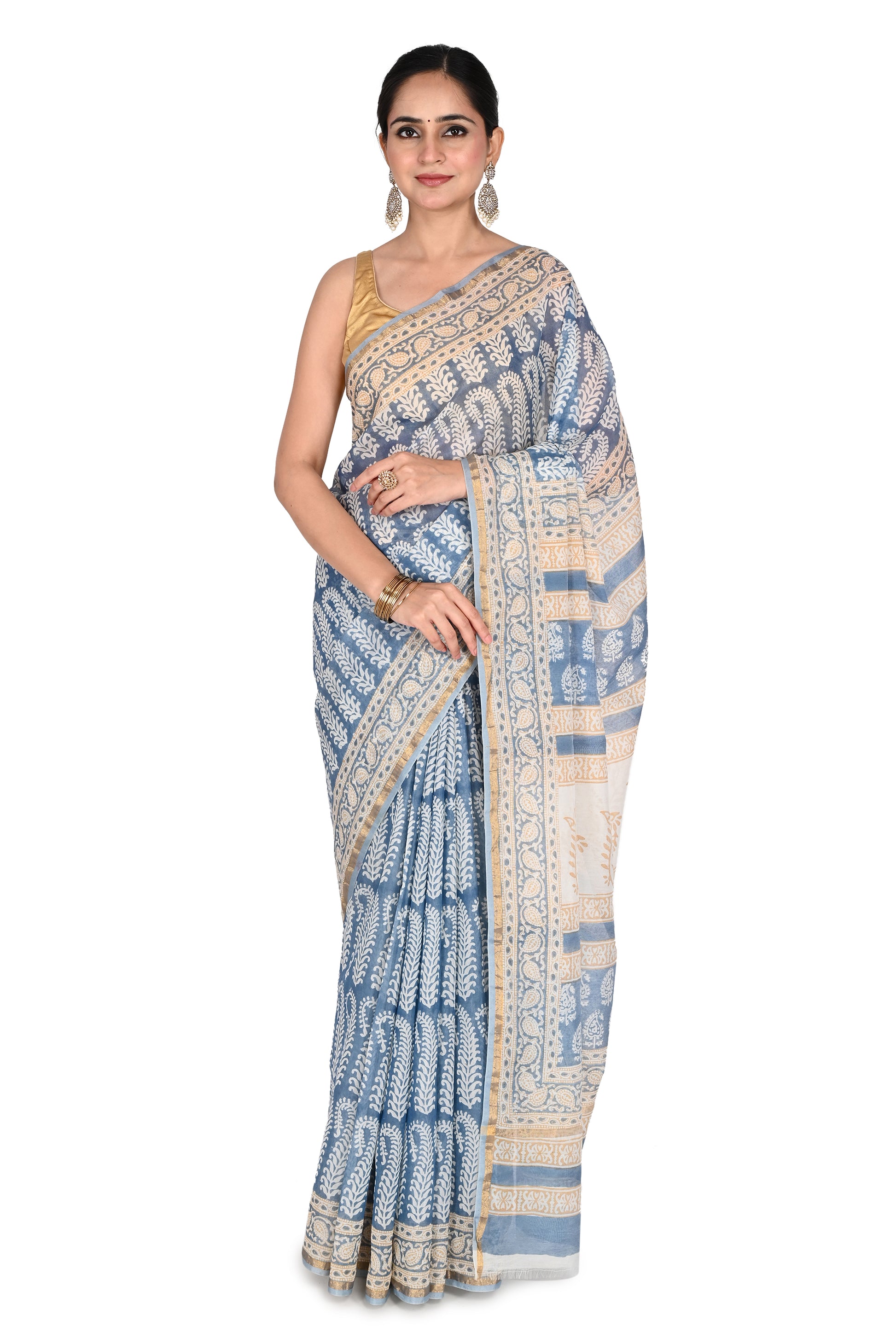 Woman modeling the Zeenia Maheshwari Saree, a blue and white hand block printed cotton silk saree with intricate geometric patterns and a gold-toned border by naitri.in