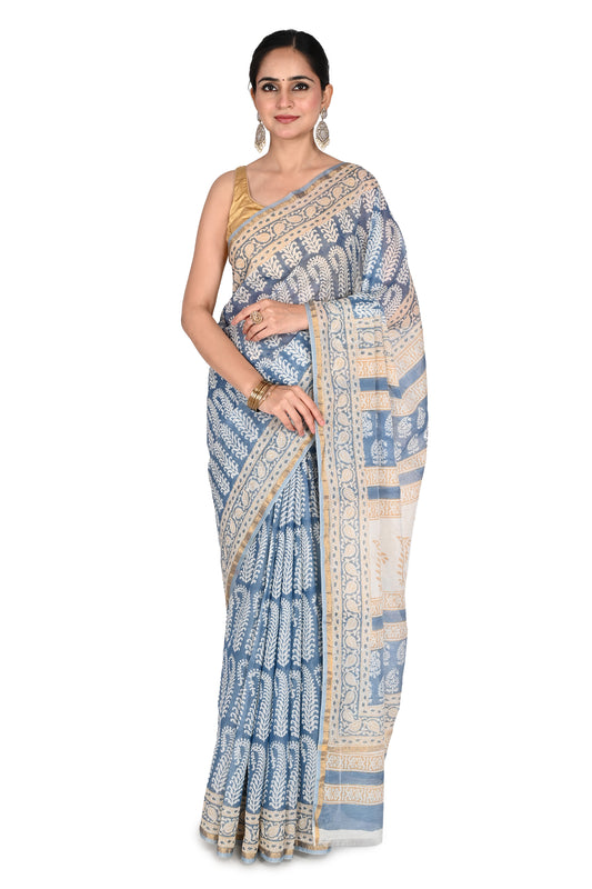 Woman modeling the Zeenia Maheshwari Saree, a blue and white hand block printed cotton silk saree with intricate geometric patterns and a gold-toned border by naitri.in