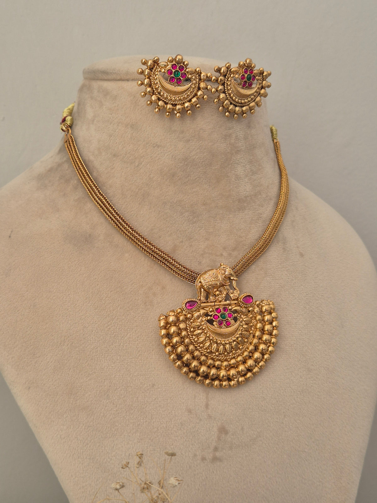 Zika Gold Temple Necklace Set with Elephant Motif | Naitri Ethnic Jewellery. Traditional gold temple chain necklace and earring set with pink stones. by naitri.in