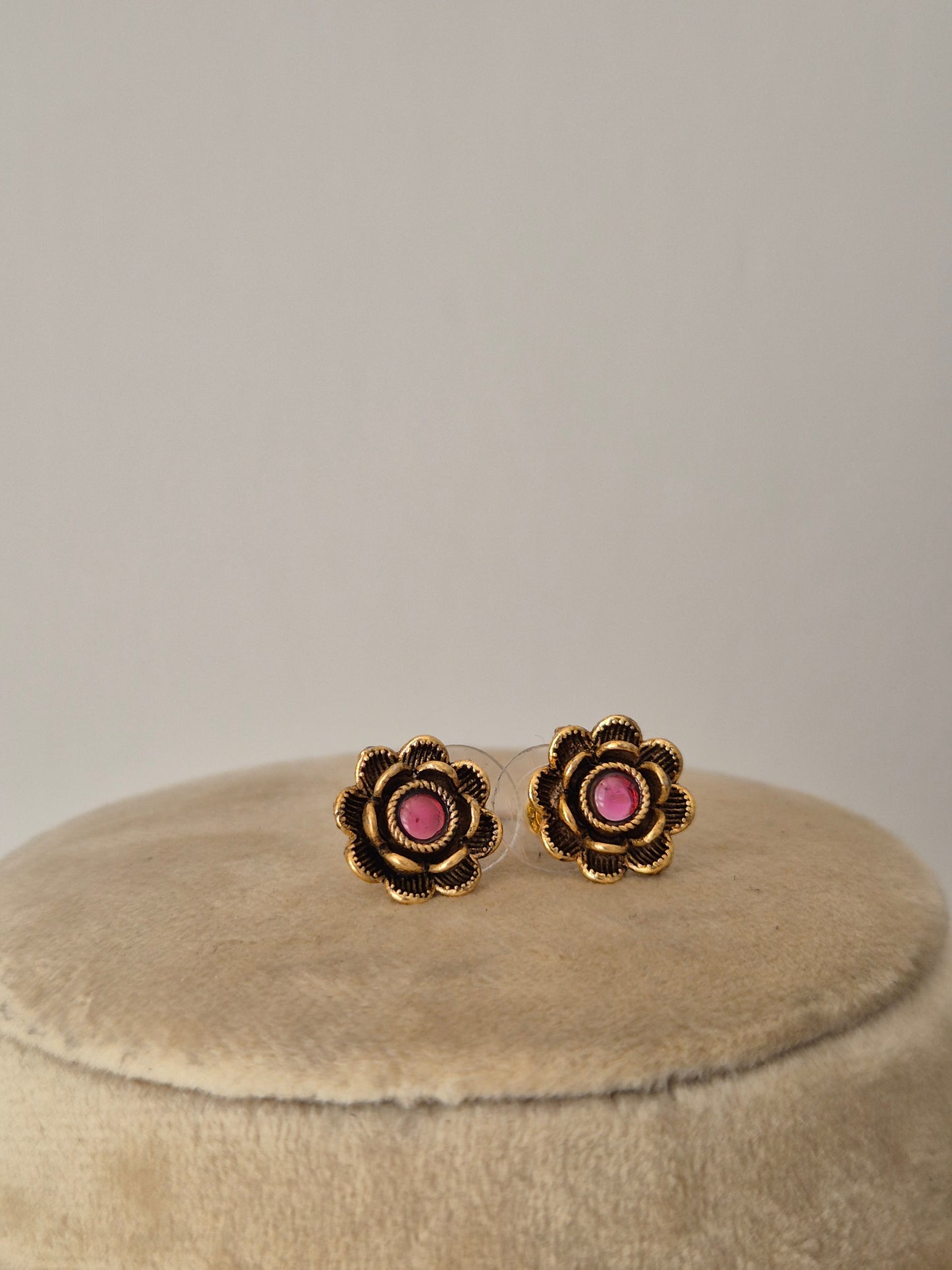 Artisanal necklace with floral stone embellishments and coordinating stud earrings by naitri.in