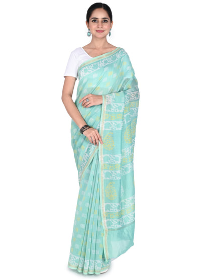 a woman wearing the seafoam green Jency hand block printed cotton-silk saree, showing the detailed pallu draped over the shoulder by naitri.in