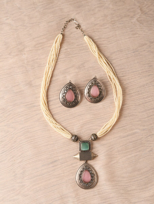 Beige and silver beaded necklace set, Resha by Naitri, with matching earrings.
