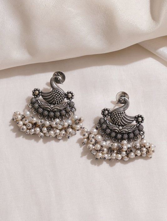 Long silver dangle earrings, Mrigya by Naitri, modern oxidized design.